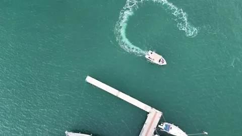 An immersive FPV drone shot capturing the entrance to a marina Stock Footage 296176210