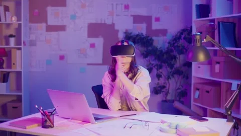 Immersive Learning, EdTech, Neon Mood. Girl Studies in VR Glasses at Home Stock Footage 306888382