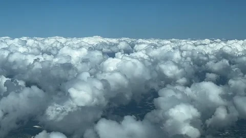 Immersive pilot POV flying over some tiny cottony and fluffy cumulus Stock Footage 280488691