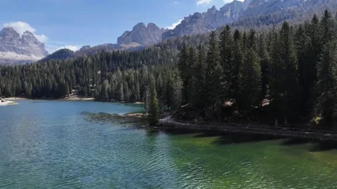 Immersive Water Surface Proximity Drone Flight Revealing Alpine Vacation Video stock 340448828