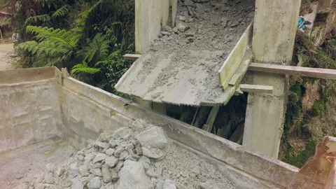 Immigrant Worker On A Steep Ramp Unloading Material Stock Footage 94736469