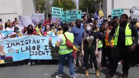 Immigrant workers demand better working conditions at US May Day marches in New  Stock Footage 204128193