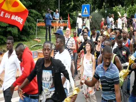Immigrants dancing during demonstration in Milan, Italy Video stock 76080512