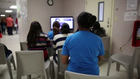 Immigrants waiting to be processed at South Texas Residential Family Centre Stock Footage 93545002