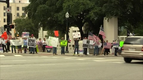 Immigration Protest wide shot with multiple flags Stock Footage 57464088