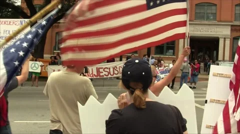 Immigration Protesters and Counter Protesters Stock Footage 57464197