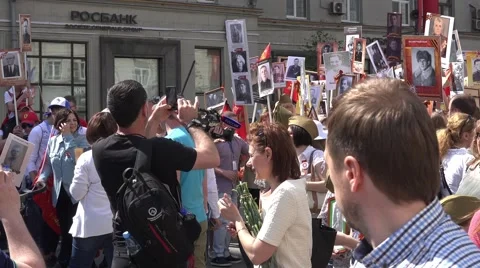 Immortal regiment march in the Victory Day on 9th of May. Marches to commemorate Stock Footage 66082004