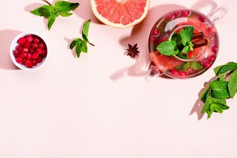 Immunity boosting drink. Mint Tea with cranberries, grapefruit and spices in Stock Photos