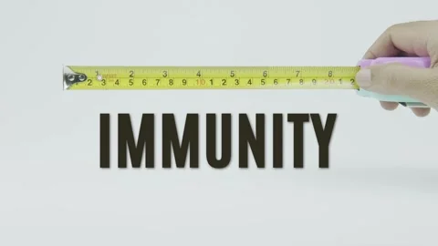 Immunity text or word and tape measure on a white background Stock Footage 302075296