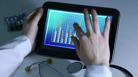 Immunologist comparing research data, watching video presentation on tablet PC Stock Footage 60840940