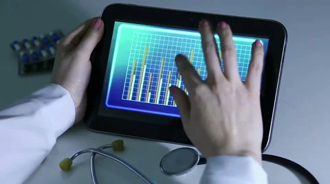 Immunologist comparing research data, watching video presentation on tablet PC Stock Footage 60843836