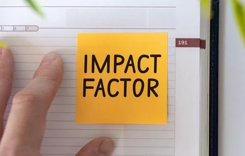 IMPACT FACTOR text on a clipboard with chart on white background, business .. Stock Photos
