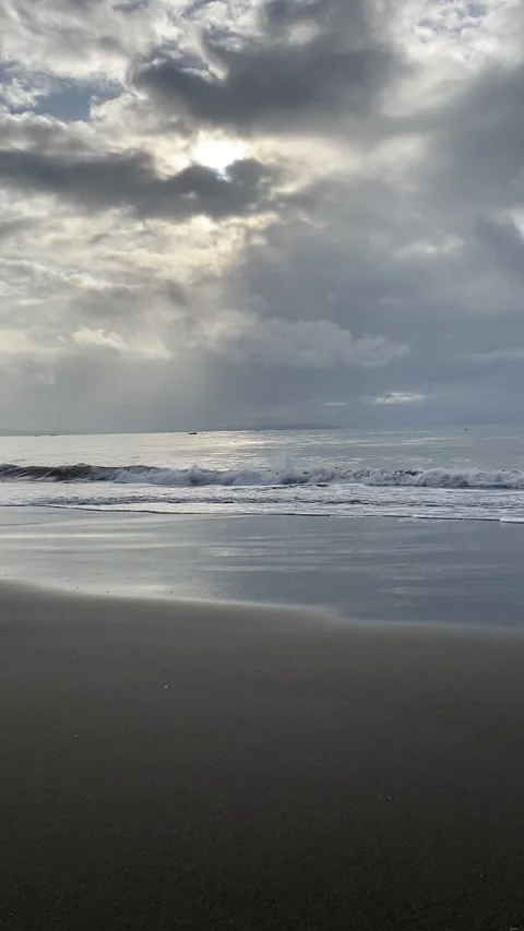 The impact of waves on the beach Stock Footage 221243867