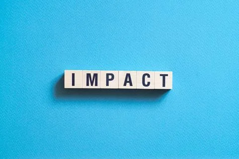 Impact - word concept on cubes, text, letters Stock Photos