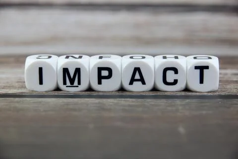 Impact wording  or text on white dice with black wooden background.Copy spa.. Stock Photos