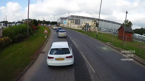 Impatient driver queue jumps in most dangerous way possible Stock Footage 109388877