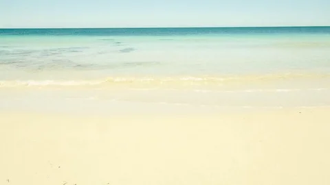 Impeccably perfect beach with pristine white sand and aqua ocean water agai.. Stock Footage 75393811