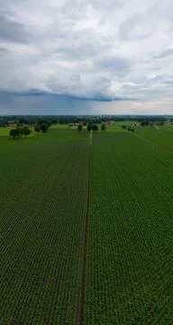 Impending Storm: Aerial View of Fields Under Gathering Clouds Stock Photos