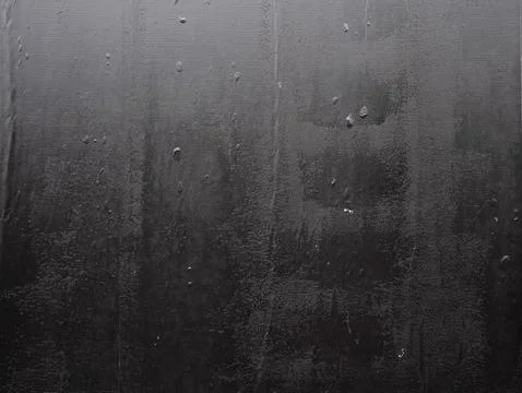 Imperfect black wheatpaste poster texture with air bubbles underneath Stock Photos
