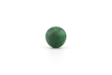 Imperial jade sphere placed on a plain white surface Stock Photos
