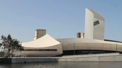 Imperial War Museum North in Salford Quays, Manchester on a sunny day Stock Footage
