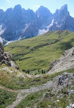 Impervious rock gully and the path to get to the valley in the European Alps Stock Photos