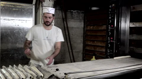 Implementation of the bread sticks on the carpet oven Stock Footage 56481610