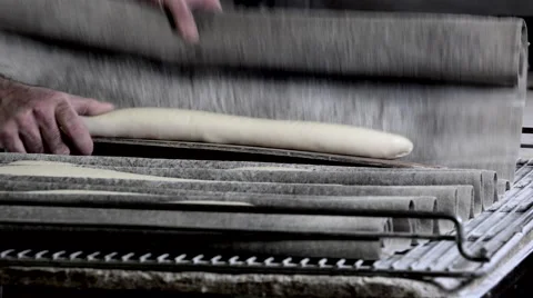Implementation of the bread sticks on the carpet oven Stock Footage 56482053