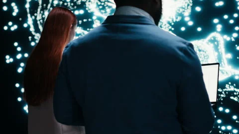 Implementing deep learning algorithms, laptop and data scientists in AI startup Stock Footage 330378492