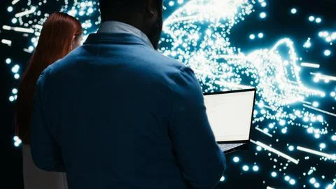 Implementing deep learning algorithms, laptop and data scientists in AI startup Stock Photos
