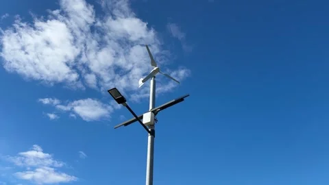 Implementing street lamps that use solar and wind energy can significantly Stock Footage 316834528