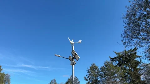 Implementing street lamps that use solar and wind energy can significantly Stock Footage 316834612