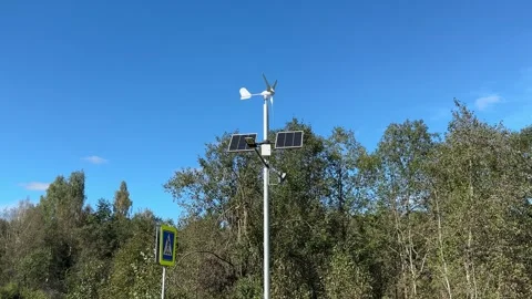Implementing street lamps that use solar and wind energy can significantly Stock Footage 316834853