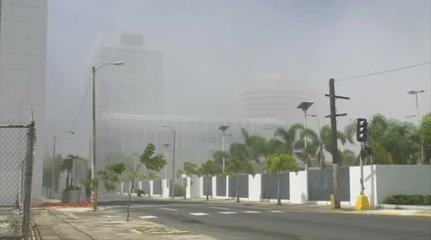 Implosion / Demolition Dust Cloud - Dust Storm covers city Stock Footage 7903876