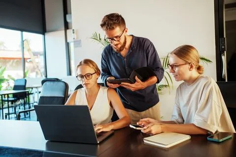 The Importance of Collaborative Teamwork in a Modern Office Setting is Vital for Stock Photos
