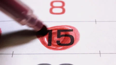 An important date the fifteenth day of month in calendar circled in red marker Stock Footage 220623160