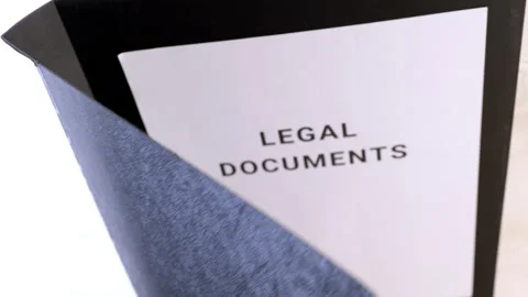 Important legal documents organized in a folder for review Stock Footage 302211285
