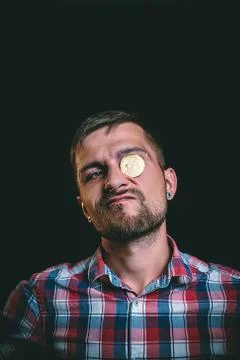 An important man with a bitcoin instead of an eye Stock Photos