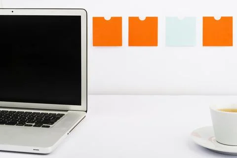 Important Messages On Lap Top On Desk With Notes And Cup Of Tea. Crutial Stock Photos