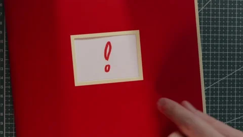 Important notice red notebook with exclamation mark label Stock Footage 341269381