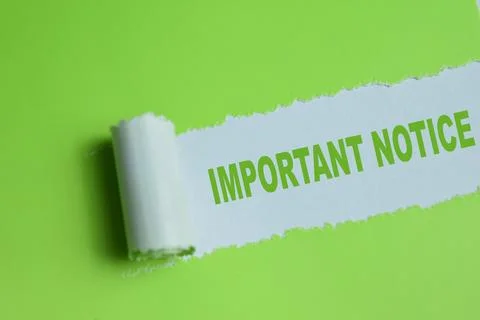 Important notice text written in torn paper. Stock Photos