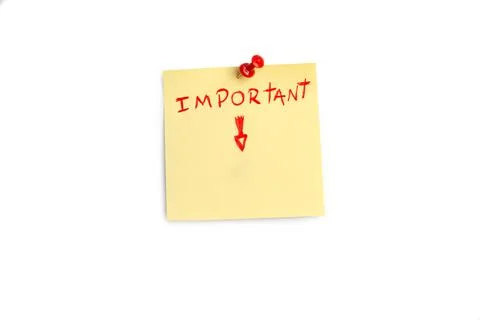 Important single word and a red arrow handwritten on a yellow sticky paper Foto stock