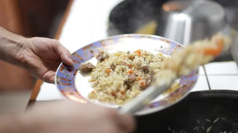 Impose on the plate hot pilaf Stock Footage 44230951