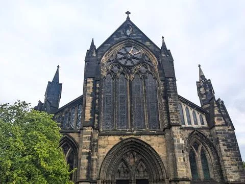The imposing medieval Gothic facade of Glasgow Cathedral against a solemn Stock Photos