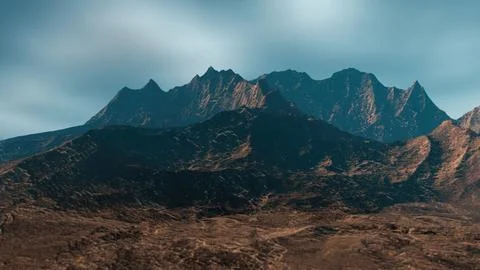 Imposing mountain range standing tall under a vast sky Stock Illustration