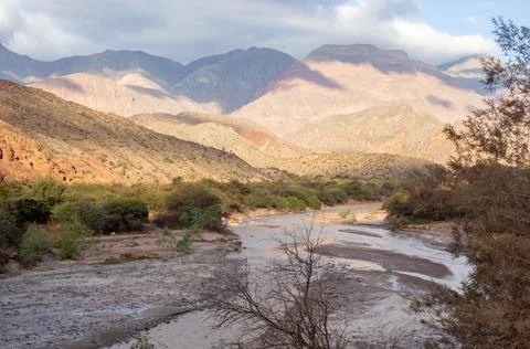 Imposing mountain scenery next to a small river in the North of Argentina. Stock Photos