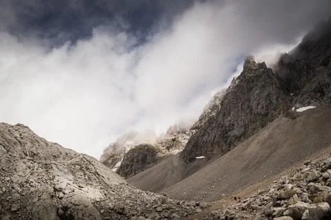 Imposing sharp limestone peaks stand amidst the fog 스톡 사진