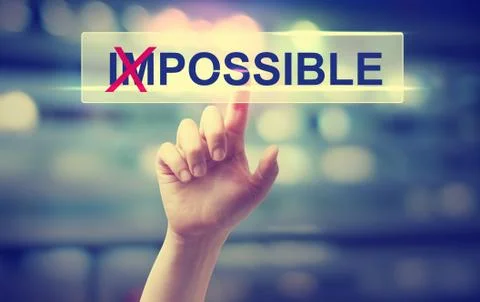 Impossible concept with hand pressing a button Stock Photos