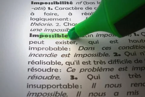 Impossible highlighted in a French dictionary Stock Photos
