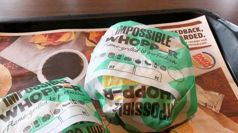 Impossible Whopper at Burger King. Meatless burger. wrapped. Stock Footage 126125876
